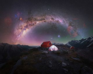 The arc of the Milky Way photographed above a lonely camping tent on top of Aoraki National Park/Mt Cook, New Zealand