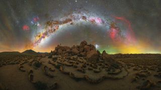 The arc of the Milky Way was photographed over a pile of rocks in the Atacama Desert, Chile